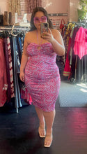 Load image into Gallery viewer, Full-body front view of a size XL Hutch for Anthropologie lavender ruched midi dress with hot pink palm pattern and keyhole bust detail styled with clear heels on a size 14/16 model.
