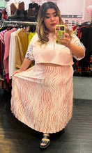 Load image into Gallery viewer, Additional full-body front view of a size 22 Eloquii cream and pink zebra print pleated maxi skirt styled with a baby pink crop top on a size 18/20 model.
