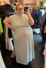 Load image into Gallery viewer, Additional full-body front view of a size 3X Athleta pastel mint green tank athletic dress styled with blue sunglasses on a size 22/24 model.

