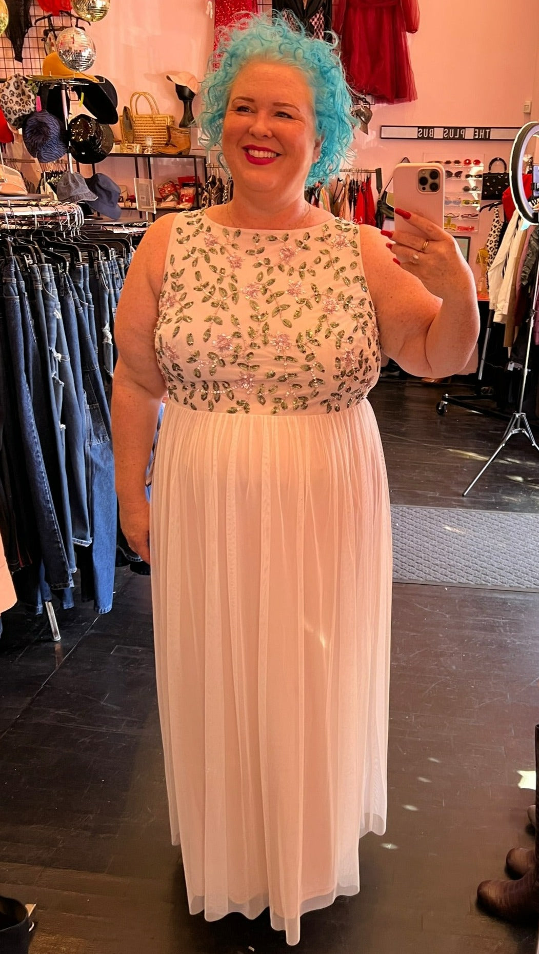 Full-body front view of a size 18W Adrianna Papell off-white and cream gown with mesh overlay and beaded and sequined floral bodice on a size 18 model.