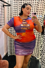 Load image into Gallery viewer, Front view of a size 14 Pretty Little Thing pink, yellow, orange, and puple water pattern keyhole bust mini dress on a size 14/16 model.
