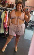 Load image into Gallery viewer, Full-body front view of a size 3X Rebdolls brown and white gingham plaid print 2-piece set styled with tan mules on a size 18/20 model.
