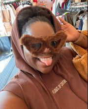 Load image into Gallery viewer, Close up view of the embroidered &quot;FLAWS OF COUTURE&quot; detail on the front of this size Shein X chocolate brown tank hoodie on a size 22/24 model.
