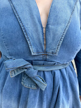 Load image into Gallery viewer, Close view of the hook-and-eye closure of the collared bust and tie belt detail of a size 3 Fashion to Figure x Patrick Starrr lightwash to mediumwash ombré denim belted mini dress with collar and hook-and-eye bust detail on a size 22/24 model.
