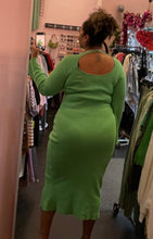 Load image into Gallery viewer, Back view of a size L/XL (fits like 16/18) vibrant seafoam green ribbed knit sweater dress with a higher neckline and an open back styled with tan heels and a chain on a size 16/18 model. The photo is taken inside under overhead lighting.
