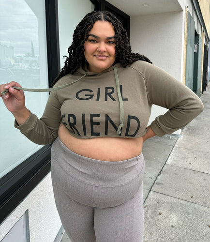 Front view of a size 2X Onuolayichu olive green cropped hoodie that reads, 