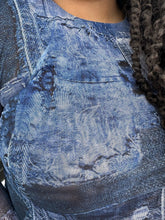 Load image into Gallery viewer, Close up on the denim patchwork pattern of this size 16 Pretty Little Thing denim patchwork pattern mesh bodycon maxi dress with cold shoulders and sheer sleeves.
