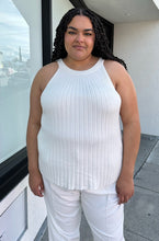 Load image into Gallery viewer, Front view of a pair of size 22 (fits like 18/20) Sally Lapointe for 11 Honoré white pleated tapered trousers styled with a white knit halter tank loose over them on a size 18/20 model.
