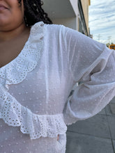 Load image into Gallery viewer, Close up view of the eyelet ruffle and all-over swiss dot texture of a size 4X SHEIN white sheer-leaning blouse with ruffled eyelet collar, all-over swiss dots, and smocked cuffs on a size 18/20 model.
