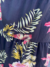Load image into Gallery viewer, Close up view of the tiers and tropical floral pattern of a size 4X SHEIN black tiered maxi skirt with pink, yellow, and green tropical floral pattern maxi skirt.
