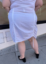 Load image into Gallery viewer, Back view of a white vertical striped midi skirt with optional side ruching styled with a white and red Mickey Mouse tee and black pumps on a size 22/24 model.
