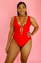 Load image into Gallery viewer, Front view of a size XL Cupshe vibrant red strappy one piece swimsuit with a tortoiseshell ring detail on a size 14 model.
