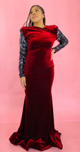 Load image into Gallery viewer, Additional full-body front view of a size 12/14 deep red velvet high-neck floor-length gown with black and silver sequin sleeves and back, shoulder pad details, and a train on a size 14 model.
