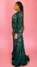 Load image into Gallery viewer, Full-body side view of a size 12/14 Melissa Mercedes emerald green intricate mesh, beading, and sequined floor-length gown on a size 14 model.
