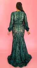 Load image into Gallery viewer, Full-body back view of a size 12/14 Melissa Mercedes emerald green intricate mesh, beading, and sequined floor-length gown on a size 14 model.
