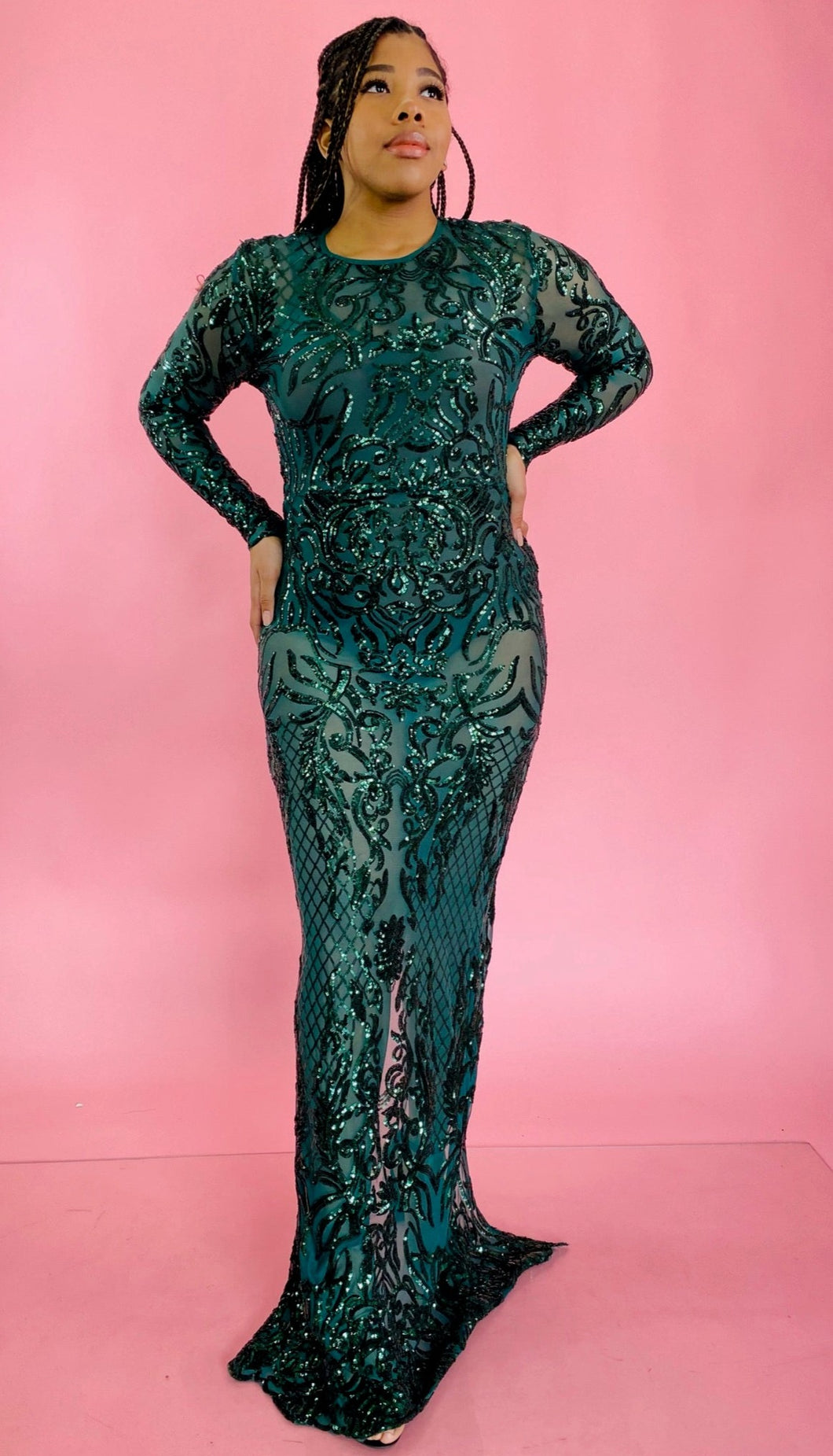 Full-body front view of a size 12/14 Melissa Mercedes emerald green body-hugging floor-length gown with intricate mesh, bead, and sequin work all throughout and a slit at the back on a size 14 model.
