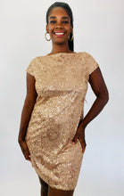 Load image into Gallery viewer, Closer front view of this size 14 Jessica Howard gold sequin mini dress with high neck and cap sleeves on a size 12 model.
