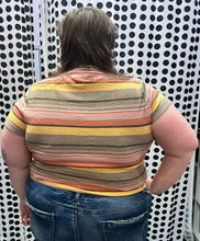 Load image into Gallery viewer, Back view of a size 3X Texture &amp; Thread (Madewell) orange, pink, brown, and cream horiztonal striped tee shirt with a tie detail at the bottom styled with medium-wash denim on a size 24 model.

