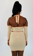 Load image into Gallery viewer, Back view of a size 1X Fashion Nova light tan and orange exposed seam 2-piece with zip-up extreme cold shoulder halter top and bodycon mini skirt on a size 12 model.
