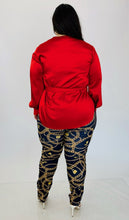 Load image into Gallery viewer, Full-body back view of this stunning size 14, size 16 Jonathan Simkhai vibrant red draped wrap top with bow detail styled with faux Versace chain patterned leggings and white strappy heels on size 14/16 model.
