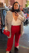 Load image into Gallery viewer, Full-body front view of a pair of size 24W Anne Klein red trousers styled with a white blouse, gray plaid blazer, and black flats on a size 24 model.
