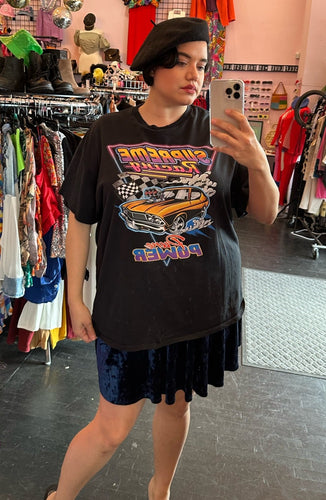 Front view of a size 2X DOM brand black 100% cotton t-shirt with a graphic of a cartoon car that reads 