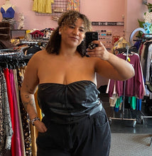 Load image into Gallery viewer, Front view of a size 4X Cider black reptile burnout print cropped tube top styled with black denim on a size 16/18 model.

