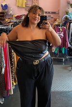 Load image into Gallery viewer, Front view demonstrating the stretch and room in the bust of a size 4X Cider black reptile burnout print cropped tube top styled with black denim on a size 16/18 model.
