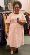 Load image into Gallery viewer, Full-body front view of a size 22 Glamorous Curve white midi dress with baby pink and red polka dot and heart mixed print styled with tan heels on a size 18/20 model.
