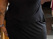 Load image into Gallery viewer, Close up view focusing on the twisted waist detail of a size 24 ASOS black tank maxi dress styled with black loafers on a size 16/18 model.

