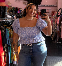 Load image into Gallery viewer, Front view of a size XXL WRAY baby blue and white smocked crop blouse with puff sleeves on a size 16/18 model.
