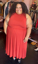 Load image into Gallery viewer, Additional full-body front view of a size 26/28 Eloquii muted red-orange sleeveless maxi dress styled with black mules on a size 24/26 model.
