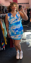Load image into Gallery viewer, Additional full-body front view of a size 18 Collusion brand bright blue, light blue, and white acid wash tie dye mini dress styled with white sneakers on a size 16/18 model.
