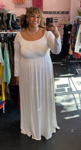 Load image into Gallery viewer, Additional full-body front view of a size 3X Pink Blush brand off-white floor length maxi dress with scoop neck styled with pearl necklaces on a size 16/18 model. The photo is taken inside in overhead lighting.
