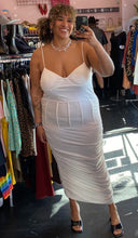 Load image into Gallery viewer, Additional full-body front view of a size 3X Finesse brand white ruched maxi dress with corset-style waist boning styled with black heels on a size 16/18 model.
