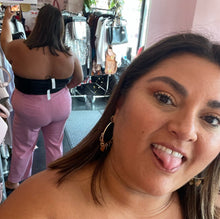 Load image into Gallery viewer, Back view of a size 4X Cider black reptile burnout print cropped tube top styled with cropped pink trousers on a size 18/20 model.
