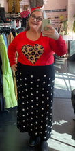Load image into Gallery viewer, Full-body front view of a size 2X Victor Glemaud x Target black and white polka dot sweater maxi skirt styled with a red leopard sweater and black boots on a size 20/22 model.
