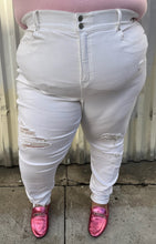 Load image into Gallery viewer, Front view of a pair of size 24 Fashion to Figure slight high-waisted white distressed denim with the distressing focused at the knee and shins styled with a pink tee and pink loafers on a size 24/26 model.
