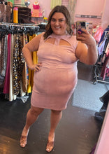 Load image into Gallery viewer, Full-body front view of a size 3 Fashion to Figure baby pink suede sheath dress with bust cut-outs styled with brown heels on a size 18/20 model.
