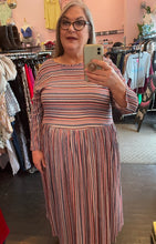 Load image into Gallery viewer, Full-body front view of a size 3/4X GOZZIP (UK brand) muted pink, blue, orange, and white horizontal and vertical striped long sleeve maxi dress on a size 20/22 model.
