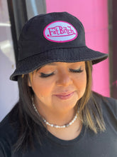 Load image into Gallery viewer, Close up on the black FAT BITCH bucket hat, a black hat with a white and pink embroidered patch that reads &quot;Fat Bitch.&quot;
