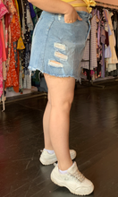 Load image into Gallery viewer, Side view of a size 1X SHEIN light wash paperbag waist denim mini skirt styled with a yellow off the shoulder top and white sneakers on a size 12 model.
