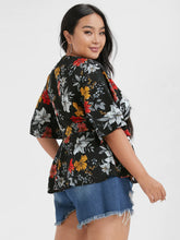 Load image into Gallery viewer, BLOOMCHIC WRAP STYLE BELTED V NECK WITH FLORAL DESIGN ON SOLID COLOR BACKGROUND
