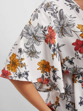 Load image into Gallery viewer, BLOOMCHIC WRAP STYLE BELTED V NECK WITH FLORAL DESIGN ON SOLID COLOR BACKGROUND
